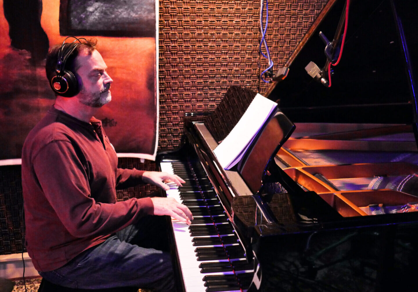 Joe Carolus recording at the piano in the studio